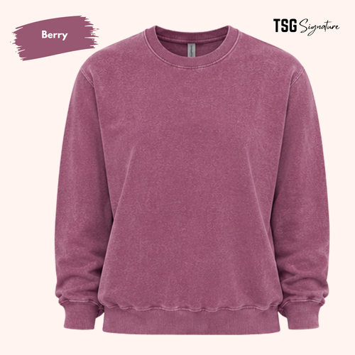 A berry purple crewneck sweatshirt shown against a light cream background, with a 'Berry' color swatch in the top-left corner and 'TSG Signature' branding in the top-right.